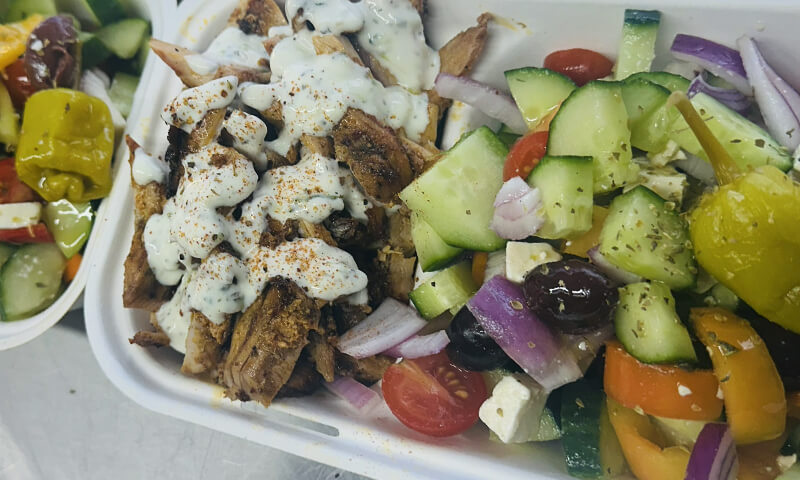 Traditional Greek gyros meat served with Greek salad Pete the Greek